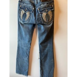 Miss Me light blue jeans.  Angel wings with stones on pockets.